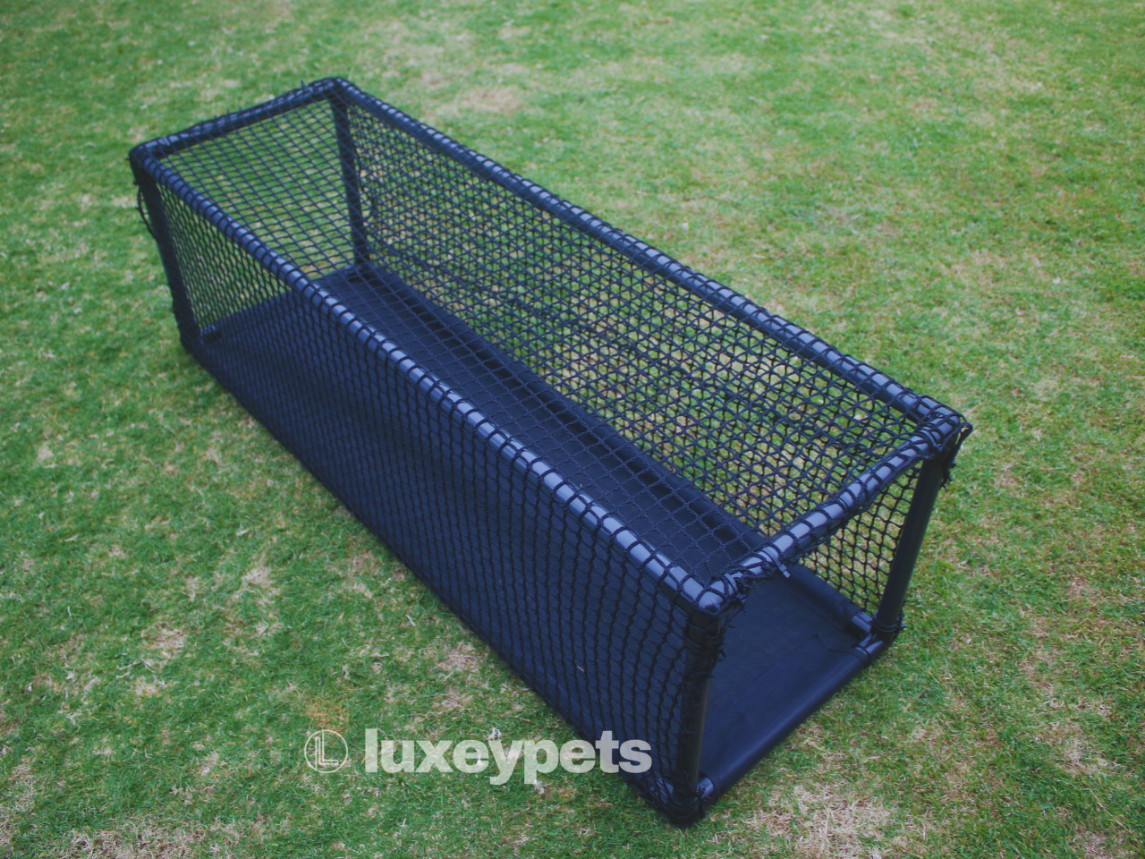 Blue pet playpen on a grassy background with 'luxeypets' branding.