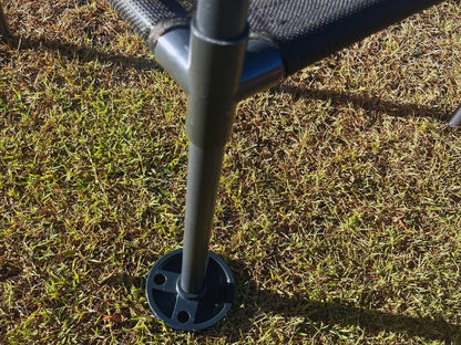Chair leg with ground spike on grass